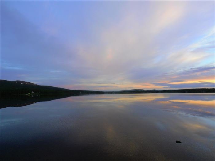 Sunset over a Lapland lake near Nuolja and Njulla mountain